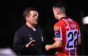 6 March 2023; Referee David Dunne speaking to Jordan McEneff of Derry City during the SSE Airtricity Men's Premier Division match between UCD and Derry City at the UCD Bowl in Dublin. Photo by Stephen McCarthy/Sportsfile