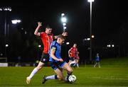 6 March 2023; Jack Keaney of UCD in action against Cian Kavanagh of Derry City during the SSE Airtricity Men's Premier Division match between UCD and Derry City at the UCD Bowl in Dublin. Photo by Stephen McCarthy/Sportsfile