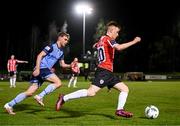 6 March 2023; Brandon Kavanagh of Derry City in action against Mark Dignam of UCD during the SSE Airtricity Men's Premier Division match between UCD and Derry City at the UCD Bowl in Dublin. Photo by Stephen McCarthy/Sportsfile