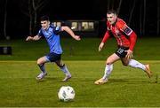 6 March 2023; Ryan Graydon of Derry City in action against Brendan Barr of UCD during the SSE Airtricity Men's Premier Division match between UCD and Derry City at the UCD Bowl in Dublin. Photo by Stephen McCarthy/Sportsfile