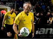 6 March 2023; Referee Ray Matthews picks up the matchball before during the SSE Airtricity Men's Premier Division match between Bohemians and Drogheda United at Dalymount Park in Dublin. Photo by Harry Murphy/Sportsfile