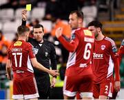 6 March 2023; Referee Robert Harvey shows a yellow card to Darragh Crowley of Cork City, 17, during the SSE Airtricity Men's Premier Division match between Shamrock Rovers and Cork City at Tallaght Stadium in Dublin. Photo by Piaras Ó Mídheach/Sportsfile