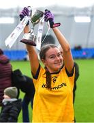 8 March 2023; DCU Dóchas Éireann captain Fainche Grimes lifts the cup after her side's victory in the 2023 Yoplait Ladies HEC Cup Final match between DCU Dóchas Éireann and Ulster University Magee at University of Galway Connacht GAA Air Dome in Bekan, Mayo. Photo by Piaras Ó Mídheach/Sportsfile