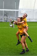 8 March 2023; DCU Dóchas Éireann players Leah Dormer and Fainche Grimes, top, celebrate with the cup after their side's victory in the 2023 Yoplait Ladies HEC Cup Final match between DCU Dóchas Éireann and Ulster University Magee at University of Galway Connacht GAA Air Dome in Bekan, Mayo. Photo by Piaras Ó Mídheach/Sportsfile