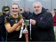 8 March 2023; TUS Midwest captain Aisling Morrissey is presented with the cup by Ladies HEC chairperson Daniel Caldwell after her side's victory in the 2023 Yoplait Ladies HEC Donaghy Cup Final match between University of Limerick and TUS Midwest at at University of Galway Connacht GAA Air Dome in Bekan, Mayo. Photo by Piaras Ó Mídheach/Sportsfile