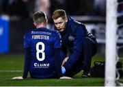 3 March 2023; St Patrick's Athletic head of medical Sam Rice, right, with Chris Forrester of St Patrick's Athletic during the SSE Airtricity Men's Premier Division match between Dundalk and St Patrick's Athletic at Oriel Park in Dundalk, Louth. Photo by Ben McShane/Sportsfile