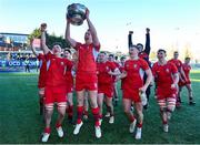 10 March 2023; Jamie Collins of CUS celebrates with the Vinnie Murray Cup alongside teammates after their side's victory in the Bank of Ireland Vinnie Murray Cup Final match between CUS and St Andrew's College at Energia Park in Dublin. Photo by Seb Daly/Sportsfile