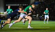 10 March 2023; Andrew Osborne of Ireland beats the tackle of Geordie Gwynn of Scotland on the way to scoring his side's frst try during the U20 Six Nations Rugby Championship match between Scotland and Ireland at Scotstoun Stadium in Glasgow, Scotland. Photo by Brendan Moran/Sportsfile