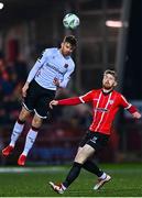 10 March 2023; Archie Davies of Dundalk in action against Jamie McGonigle of Derry City during the SSE Airtricity Men's Premier Division match between Derry City and Dundalk at The Ryan McBride Brandywell Stadium in Derry. Photo by Ben McShane/Sportsfile