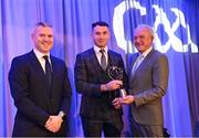 10 March 2023; Ryan McGarry of Dunloy Cúchullain's is presented with his AIB GAA Hurling Club Team of The Year award by GAA Vice President John Murphy and AIB CMO Mark Doyle, at the AIB Club Players Awards at Croke Park in Dublin. Photo by Ramsey Cardy/Sportsfile