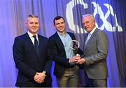 10 March 2023; Michael Warnock of Watty Graham’s Glen is presented with his AIB GAA Football Club Team of The Year award by GAA Vice President John Murphy, right, and AIB CMO Mark Doyle, at the AIB Club Players Awards at Croke Park in Dublin. Photo by Ramsey Cardy/Sportsfile