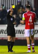 10 March 2023; Referee Neil Doyle shows a yellow card to Joe Redmond of St Patrick's Athletic during the SSE Airtricity Men's Premier Division match between St Patrick's Athletic and Bohemians at Richmond Park in Dublin. Photo by Stephen McCarthy/Sportsfile