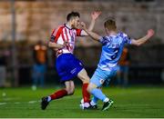 10 March 2023; Ben O'Riordan of Treaty United in action against Can Browne of Cobh Ramblers during the SSE Airtricity Men's First Division match between Treaty United and Cobh Ramblers at Markets Field in Limerick. Photo by Michael P Ryan/Sportsfile
