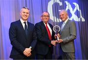 10 March 2023; Gerry Walsh, father of Shane Walsh of Kilmacud Crokes collects the AIB GAA Football Club Team of The Year award on his behalf from GAA Vice President John Murphy, right, and AIB CMO Mark Doyle, at the AIB Club Players Awards at Croke Park in Dublin. Photo by Ramsey Cardy/Sportsfile