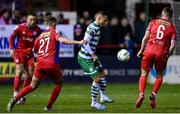 10 March 2023; Graham Burke of Shamrock Rovers in action against Evan Caffrey, left, and Jonathan Lunney of Shelbourne during the SSE Airtricity Men's Premier Division match between Shelbourne and Shamrock Rovers at Tolka Park in Dublin. Photo by Seb Daly/Sportsfile