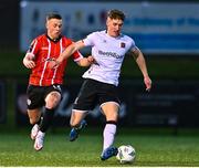 10 March 2023; John Martin of Dundalk in action against Ben Doherty of Derry City during the SSE Airtricity Men's Premier Division match between Derry City and Dundalk at The Ryan McBride Brandywell Stadium in Derry. Photo by Ben McShane/Sportsfile
