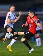 10 March 2023; Robbie Benson of Dundalk in action against Ciarán Coll of Derry City during the SSE Airtricity Men's Premier Division match between Derry City and Dundalk at The Ryan McBride Brandywell Stadium in Derry. Photo by Ben McShane/Sportsfile