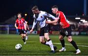 10 March 2023; Cameron Elliott of Dundalk in action against Ciaron Harkin of Derry City during the SSE Airtricity Men's Premier Division match between Derry City and Dundalk at The Ryan McBride Brandywell Stadium in Derry. Photo by Ben McShane/Sportsfile