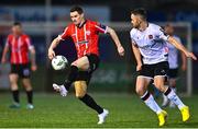 10 March 2023; Ciarán Coll of Derry City in action against Robbie Benson of Dundalk during the SSE Airtricity Men's Premier Division match between Derry City and Dundalk at The Ryan McBride Brandywell Stadium in Derry. Photo by Ben McShane/Sportsfile