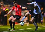 10 March 2023; Patrick McEleney of Derry City in action against Cameron Elliott of Dundalk during the SSE Airtricity Men's Premier Division match between Derry City and Dundalk at The Ryan McBride Brandywell Stadium in Derry. Photo by Ben McShane/Sportsfile