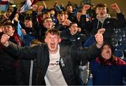 10 March 2023; Drogheda fans celebrate after their sides victory in the SSE Airtricity Men's Premier Division match between UCD and Drogheda United at UCD Bowl in Dublin. Photo by Stephen Marken/Sportsfile