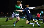 10 March 2023; Rory Telfer of Ireland steps inside Charlie Clare of Scotland on the way to scoring his side's 11th try during the U20 Six Nations Rugby Championship match between Scotland and Ireland at Scotstoun Stadium in Glasgow, Scotland. Photo by Brendan Moran/Sportsfile