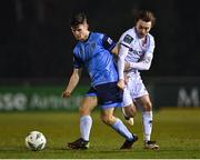 10 March 2023; Dara Keane of UCD in action against Darragh Markey of Drogheda United  during the SSE Airtricity Men's Premier Division match between UCD and Drogheda United at UCD Bowl in Dublin. Photo by Stephen Marken/Sportsfile