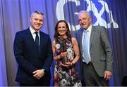 10 March 2023; Katrina Holden, sister of Joey Holden of Shamrocks Ballyhale, collects the AIB GAA Hurling Club Player of The Year award on his behalf fromGAA Vice President John Murphy, right, and AIB CMO Mark Doyle, at the AIB Club Players Awards at Croke Park in Dublin. Photo by Ramsey Cardy/Sportsfile