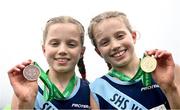 11 March 2023; Minor girls 2000m medallists, and twins, Freya Renton, right, gold, and Holly Renton, bronze, both of Sacred Heart School Westport, Mayo, with their medals after the race  during the 123.ie All-Ireland Schools Cross Country Championships at SETU Sports Campus in Carriganore, Waterford. Photo by David Fitzgerald/Sportsfile