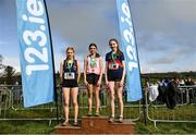 11 March 2023; Intermediate girls 3500m medallists, Emily Bolton of Mount Sackville Secondary School Chapelizod, Dublin, gold, Clodagh Gill of St Marys Ballina, Mayo, silver and Eimear Cooney of Sacred Heart Secondary School, bronze, during the 123.ie All-Ireland Schools Cross Country Championships at SETU Sports Campus in Carriganore, Waterford. Photo by David Fitzgerald/Sportsfile