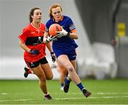 11 March 2023; Ciara McGravey of ATU Donegal in action against Mairéad Bennett of UCC during the 2023 Yoplait Ladies HEC Lynch Cup Final match between ATU Donegal and UCC at University of Galway Connacht GAA Air Dome in Bekan, Mayo. Photo by Piaras Ó Mídheach/Sportsfile