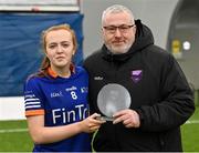 11 March 2023; Ciara McGravey of ATU Donegal is presented with the Player of the Match award by Ladies HEC chairperson Daniel Caldwell after her side's victory in the 2023 Yoplait Ladies HEC Lynch Cup Final match between ATU Donegal and UCC at University of Galway Connacht GAA Air Dome in Bekan, Mayo. Photo by Piaras Ó Mídheach/Sportsfile