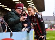 11 March 2023; Sarah Rowe of Bohemians takes a photo with supporters PJ Murray and Fiadh Murray after the SSE Airtricity Women's Premier Division match between Bohemians and Shelbourne at Dalymount Park in Dublin. Photo by Tyler Miller/Sportsfile