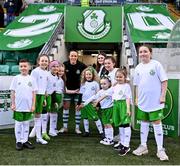 11 March 2023; Áine O'Gorman of Shamrock Rovers poses with team mascots before the SSE Airtricity Women's Premier Division match between Shamrock Rovers and Treaty United at Tallaght Stadium in Dublin. Photo by Stephen Marken/Sportsfile