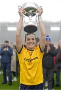 11 March 2023; DCU Dóchas Éireann captain Anna Rose Kennedy lifts the cup after her side's victory in the 2023 Yoplait Ladies HEC O’Connor Cup Final match between DCU Dóchas Éireann and University of Limerick at University of Galway Connacht GAA Air Dome in Bekan, Mayo. Photo by Piaras Ó Mídheach/Sportsfile