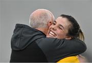 11 March 2023; DCU Dóchas Éireann captain Anna Rose Kennedy celebrates with her manager Peter Clarke after their side's victory in the 2023 Yoplait Ladies HEC O’Connor Cup Final match between DCU Dóchas Éireann and University of Limerick at University of Galway Connacht GAA Air Dome in Bekan, Mayo. Photo by Piaras Ó Mídheach/Sportsfile