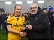 11 March 2023; Kate Kenny of DCU Dóchas Éireann is presented with the Player of the Match award by Ladies HEC chairperson Daniel Caldwell after her side's victory in the 2023 Yoplait Ladies HEC O’Connor Cup Final match between DCU Dóchas Éireann and University of Limerick at University of Galway Connacht GAA Air Dome in Bekan, Mayo. Photo by Piaras Ó Mídheach/Sportsfile