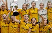 11 March 2023; DCU Dóchas Éireann captain Anna Rose Kennedy holds the cup aloft after her side's victory in the 2023 Yoplait Ladies HEC O’Connor Cup Final match between DCU Dóchas Éireann and University of Limerick at University of Galway Connacht GAA Air Dome in Bekan, Mayo. Photo by Piaras Ó Mídheach/Sportsfile
