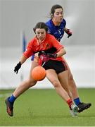 11 March 2023; Holly Fitzgerald of UCC in action against Maire Kelly of ATU Donegal during the 2023 Yoplait Ladies HEC Lynch Cup Final match between ATU Donegal and UCC at University of Galway Connacht GAA Air Dome in Bekan, Mayo. Photo by Piaras Ó Mídheach/Sportsfile