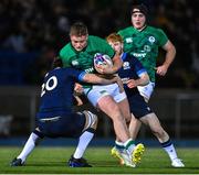 10 March 2023; Danny Sheahan of Ireland is tackled by Sam Derrick of Scotland during the U20 Six Nations Rugby Championship match between Scotland and Ireland at Scotstoun Stadium in Glasgow, Scotland. Photo by Brendan Moran/Sportsfile