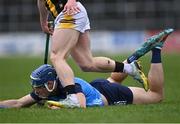 12 March 2023; Eoghan O'Donnell of Dublin on the ground after he was dispossessed by Martin Keoghan of Kilkenny, pictured, during the Allianz Hurling League Division 1 Group A match between Kilkenny and Dublin at UPMC Nowlan Park in Kilkenny. Photo by Piaras Ó Mídheach/Sportsfile