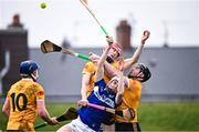 12 March 2023; Stephen Bergin of Laois in action against Antrim players, from left, Keelan Molloy, James McNaughton and Ryan McGarry during the Allianz Hurling League Division 1 Group A match between Antrim and Laois at Corrigan Park in Belfast. Photo by Ramsey Cardy/Sportsfile