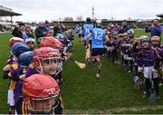 12 March 2023; Children from Kilmacud Crokes GAA club form a guard of honour for Dublin as they make their way to the pitch for the second half during the Allianz Hurling League Division 1 Group A match between Kilkenny and Dublin at UPMC Nowlan Park in Kilkenny. Photo by Piaras Ó Mídheach/Sportsfile