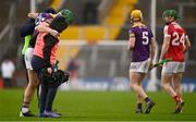 12 March 2023; Matthew O'Hanlon of Wexford is helped off the pitch after sustaining an injury during the Allianz Hurling League Division 1 Group A match between Cork and Wexford at Páirc Ui Chaoimh in Cork. Photo by Eóin Noonan/Sportsfile
