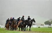 13 March 2023; Horses from trainer Gordon Elliott's string, led by jockeys Robbie Dunne, on Hardline, right, and Keith Donoghue, on Delta Work, on the gallops ahead of the Cheltenham Racing Festival at Prestbury Park in Cheltenham, England. Photo by Seb Daly/Sportsfile