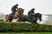 13 March 2023; Galvin, left, with Jody McGarvey up, and Delta Work, right, with Keith Donoghue up, on the gallops ahead of the Cheltenham Racing Festival at Prestbury Park in Cheltenham, England. Photo by Seb Daly/Sportsfile