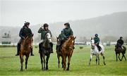 13 March 2023; Horses from trainer Willie Mullins' string, from left, Facile Vega, with David Porter up, Il Etait Temps, with Quentin Lecouer up, and State Man, with Sinead Walsh up, on the gallops ahead of the Cheltenham Racing Festival at Prestbury Park in Cheltenham, England. Photo by Seb Daly/Sportsfile