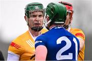 12 March 2023; Stephen Rooney of Antrim and William Dunphy of Laois tussle during the Allianz Hurling League Division 1 Group A match between Antrim and Laois at Corrigan Park in Belfast. Photo by Ramsey Cardy/Sportsfile