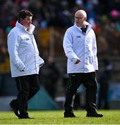 5 March 2023; Umpires Paddy Dave Coady, left, and Paddy McDermott make their way to their positions before the Allianz Football League Division 1 match between Roscommon and Mayo at Dr Hyde Park in Roscommon. Photo by Piaras Ó Mídheach/Sportsfile