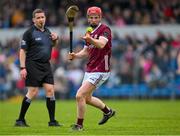 12 March 2023; Referee Colm Lyons keeps a close eye as Tom Monaghan of Galway strikes the sliotar during the Allianz Hurling League Division 1 Group B match between Clare and Galway at Cusack Park in Ennis, Clare. Photo by Ray McManus/Sportsfile